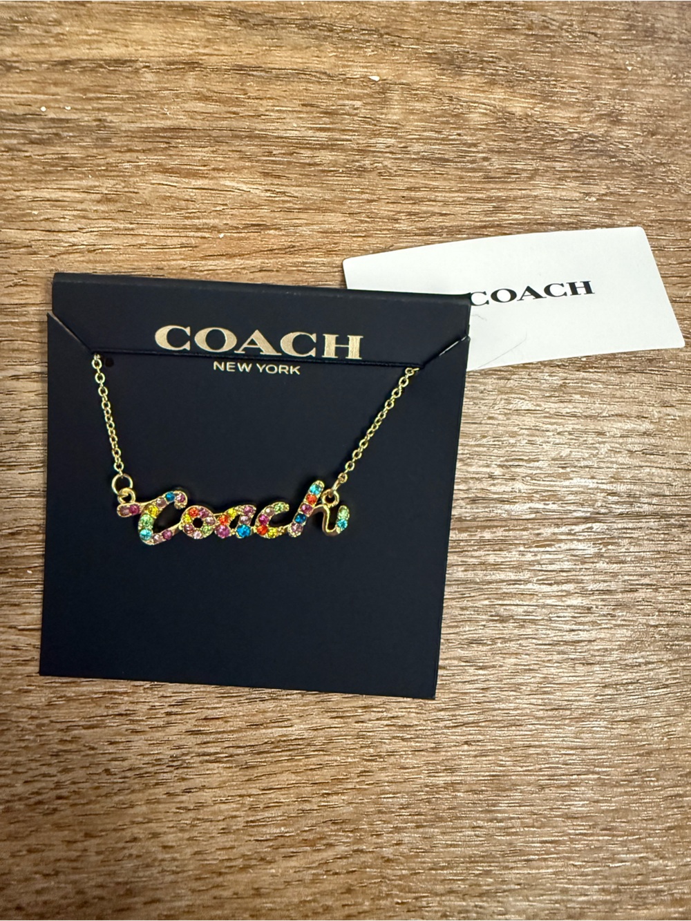 Coach Multicolor Crystal Script Logo Necklace - Gold Tone